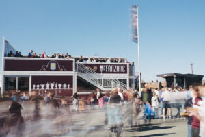 Aston Villa Fanzone modular two-storey structure with crowds of fans outside