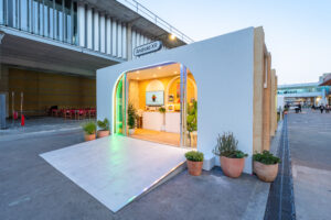 Android XR experience pavilion with open archway entrance and potted plants outside